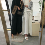 Robe longue noire musulmane pour femme avec ornements