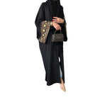 Robe longue noire musulmane pour femme avec ornements